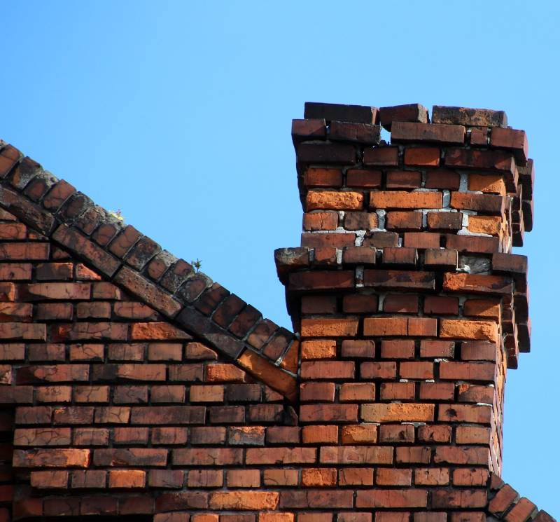 Damaged chimney on an Boxford home showing cracks and missing mortar